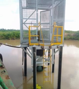 Completed wellhead platform with protective cage and ladder